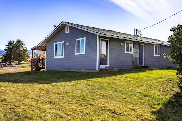 39425 Abel Ln, Polson, MT 59860 - back of property featuring a yard