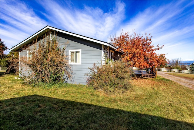 view of home's exterior featuring a lawn