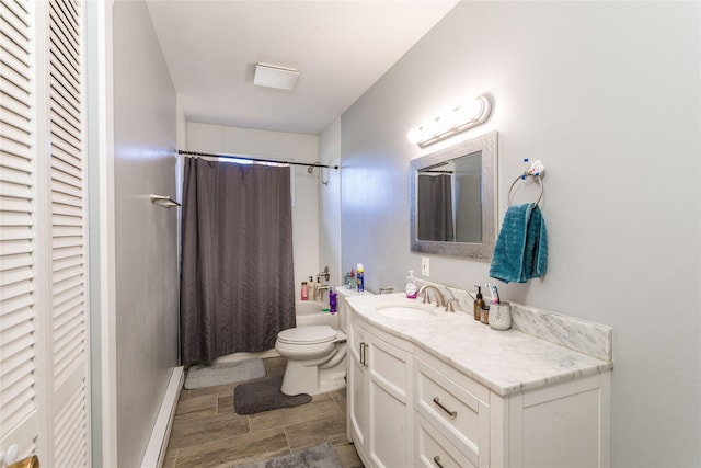 full bathroom with vanity, a closet, shower / bath combination with curtain, toilet, and baseboards