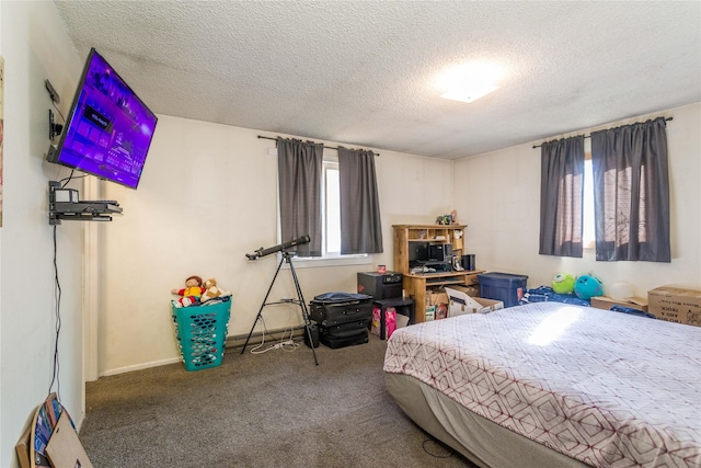 bedroom with a textured ceiling and carpet