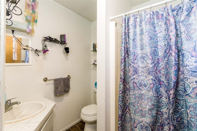 full bathroom with vanity, a shower with shower curtain, wood finished floors, and toilet