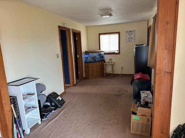 interior space with carpet flooring and baseboards