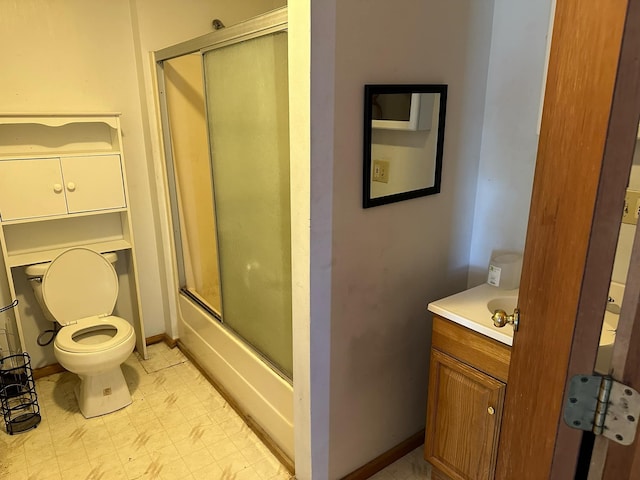 full bathroom with vanity, toilet, and enclosed tub / shower combo