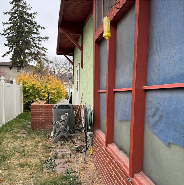 view of home's exterior with cooling unit