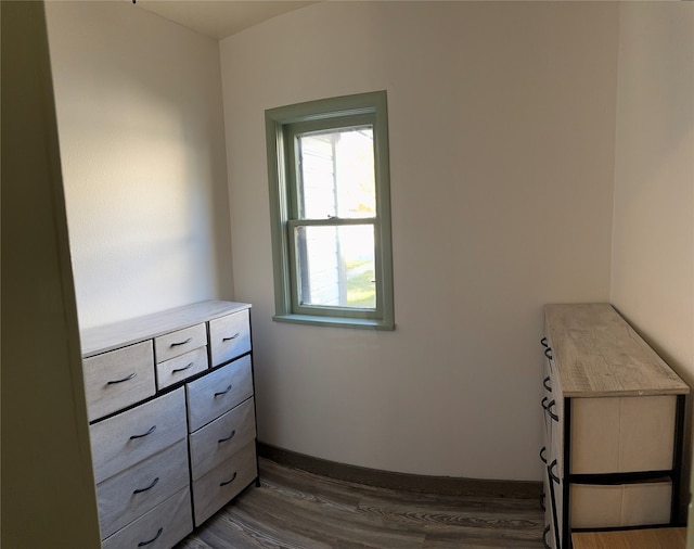 bedroom with dark hardwood / wood-style flooring