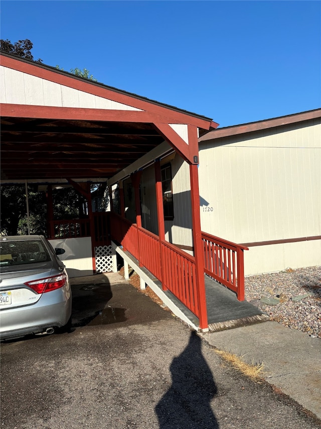 view of side of property with a carport