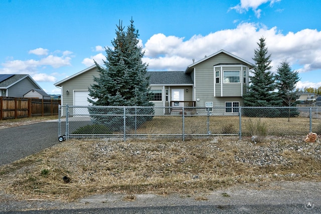 890 Antares Rd, Helena, MT 59602 - view of front of home with a garage and asphalt driveway