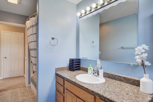 bathroom featuring shower / bathtub combination with curtain and vanity