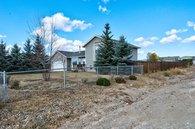 890 Antares Rd, Helena, MT 59602 - rear view of house featuring a garage