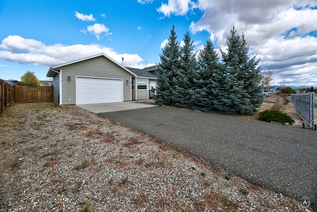 890 Antares Rd, Helena, MT 59602 - view of front facade featuring driveway and a garage