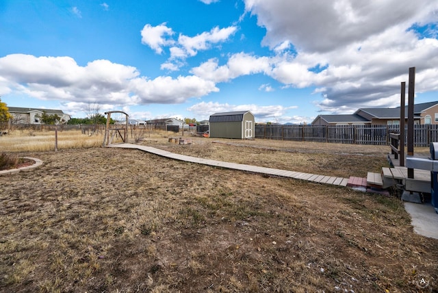 view of yard with a storage unit