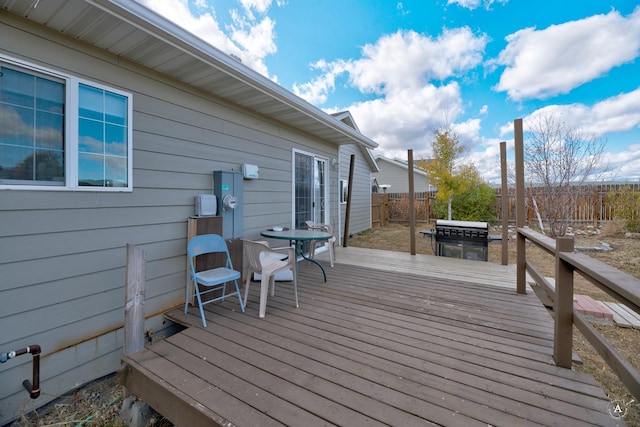 890 Antares Rd, Helena, MT 59602 - wooden terrace featuring a fenced backyard and a grill
