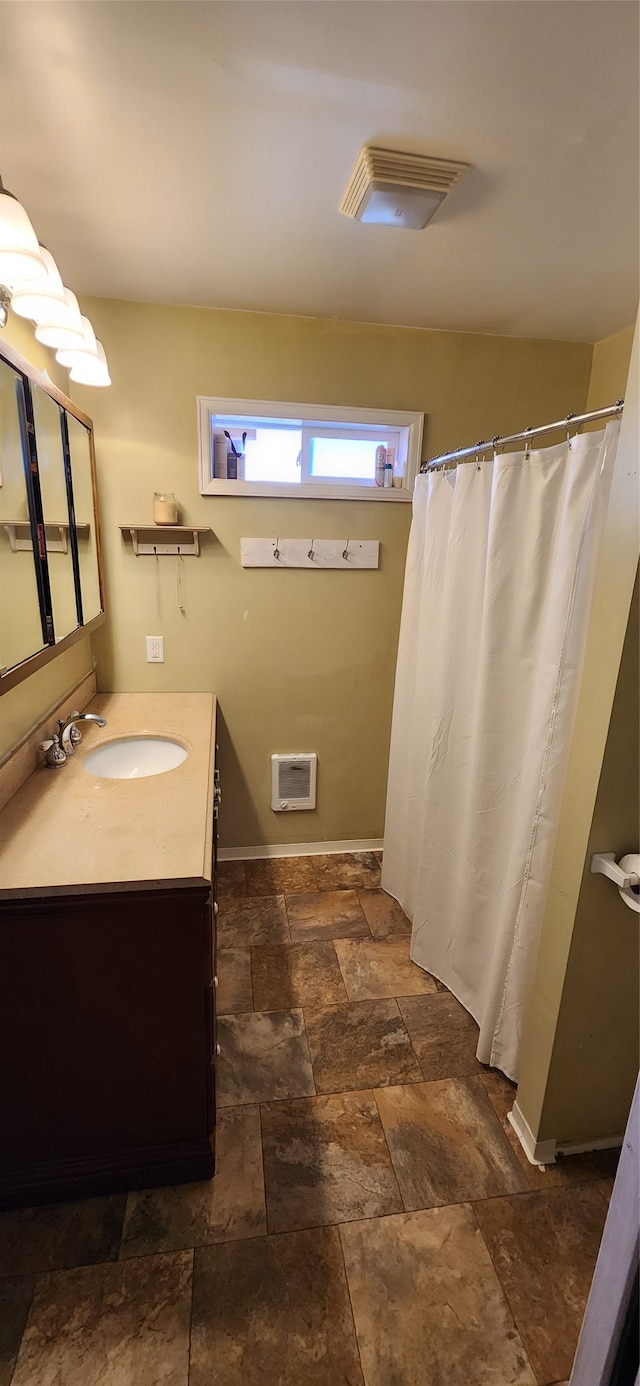 bathroom with vaulted ceiling