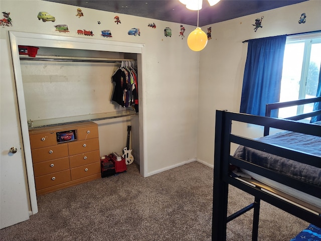 carpeted bedroom featuring a closet