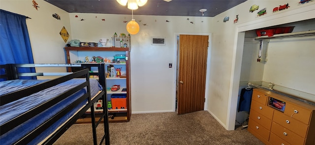 carpeted bedroom featuring a closet