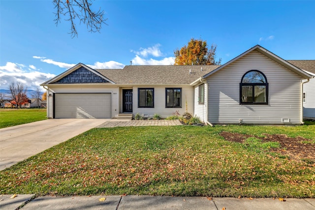 ranch-style house with a garage and a front lawn