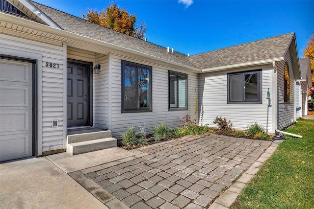 entrance to property featuring a garage