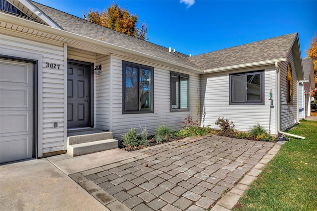 property entrance with a garage