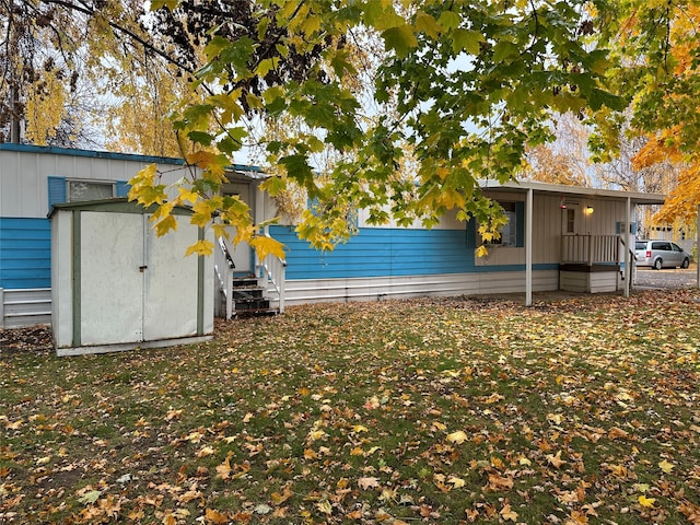 exterior space featuring a yard and a shed