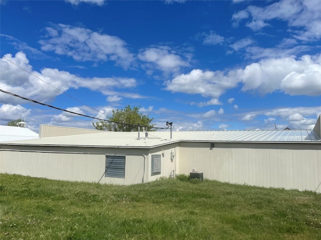5 1st St N, Cascade, MT 59421 - rear view of house featuring a lawn, central AC unit, and metal roof