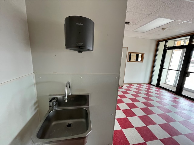 kitchen with sink and a drop ceiling