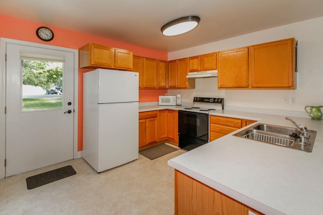 11 Iris Ct, Kalispell, MT 59901 - kitchen featuring white appliances, a sink, under cabinet range hood, and light countertops