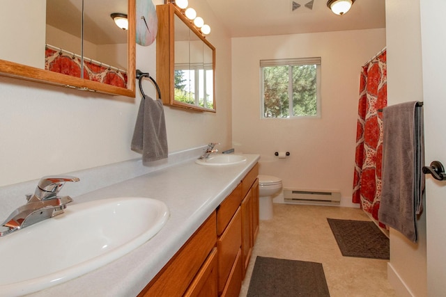 11 Iris Ct, Kalispell, MT 59901 - bathroom with baseboard heating, double vanity, toilet, and a shower with curtain