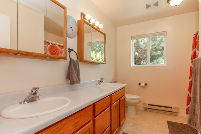 11 Iris Ct, Kalispell, MT 59901 - bathroom with a baseboard radiator, double vanity, toilet, and curtained shower