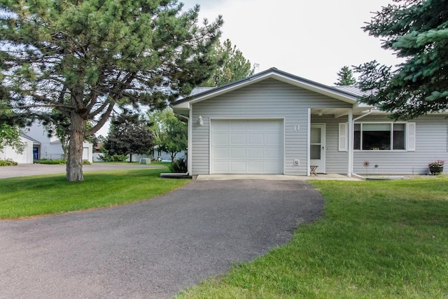 11 Iris Ct, Kalispell, MT 59901 - ranch-style home with a garage, driveway, and a front yard
