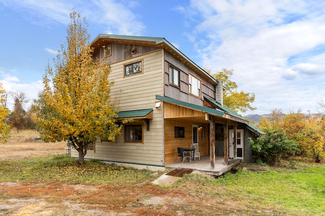 back of house with a yard