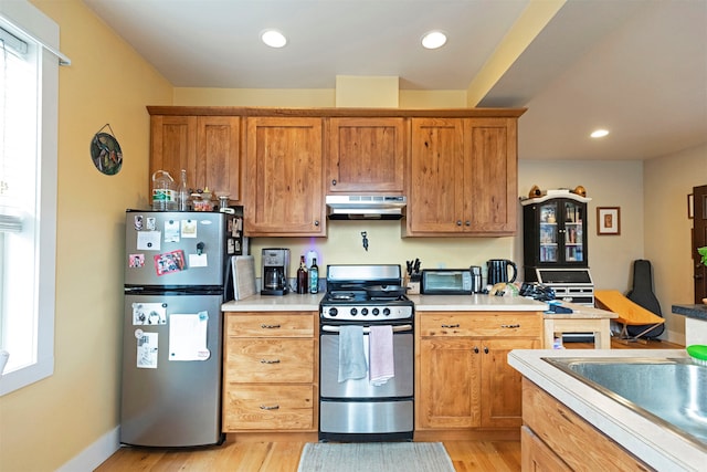 kitchen featuring light hardwood / wood-style flooring and stainless steel appliances