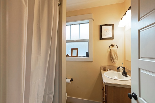 bathroom with vanity and toilet