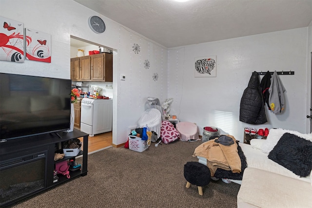 interior space with a textured ceiling and carpet flooring