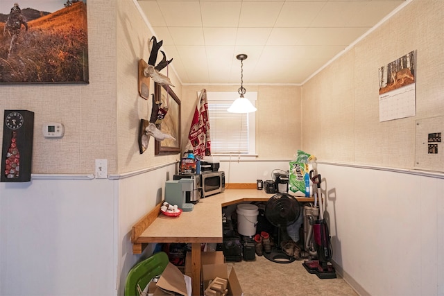 carpeted home office with crown molding