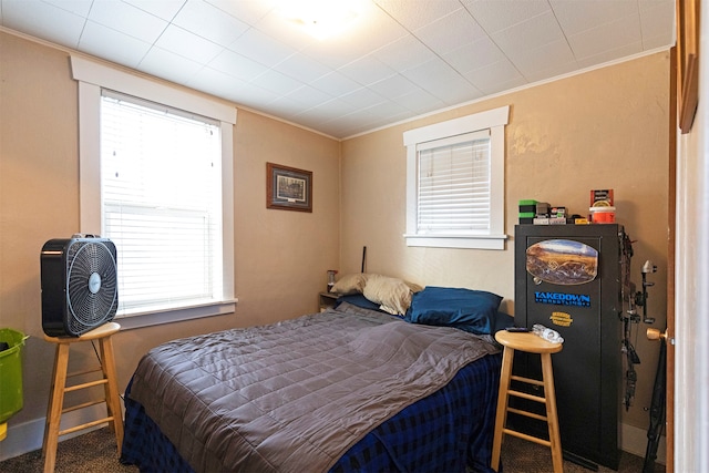 bedroom featuring carpet and ornamental molding