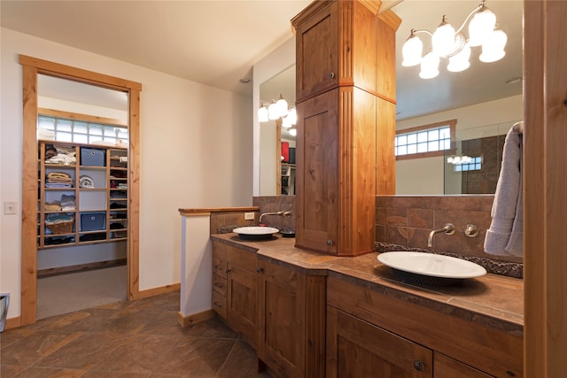 bathroom with vanity and tasteful backsplash