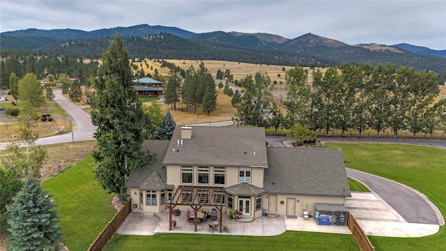 drone / aerial view featuring a mountain view