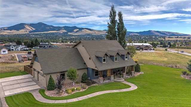 birds eye view of property with a mountain view