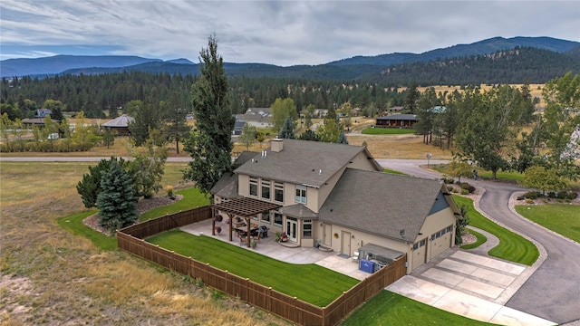 birds eye view of property featuring a mountain view