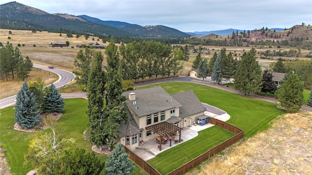 birds eye view of property with a mountain view