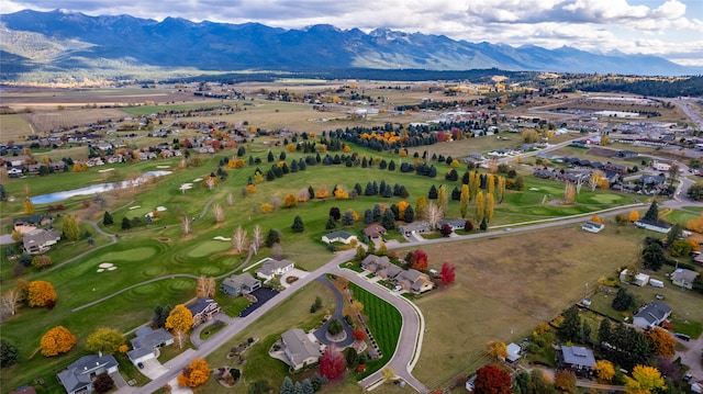 birds eye view of property with a mountain view