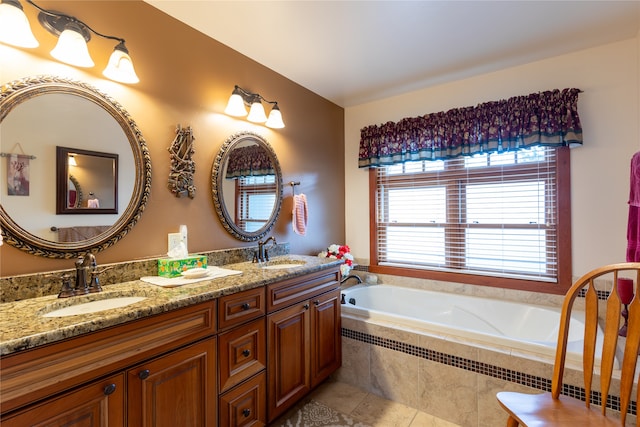 bathroom featuring vanity, tiled tub, and tile patterned floors