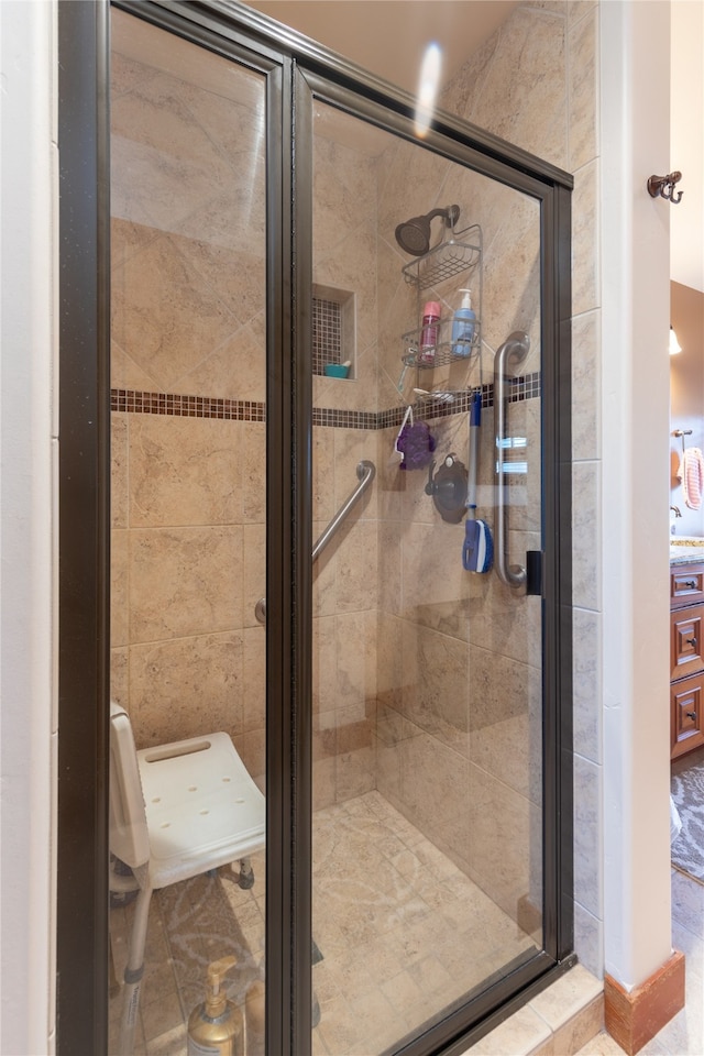 bathroom with walk in shower and tile patterned floors