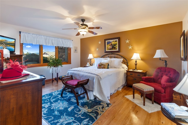 bedroom featuring ceiling fan and light wood-type flooring