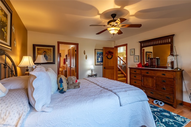 bedroom featuring light hardwood / wood-style floors and ceiling fan