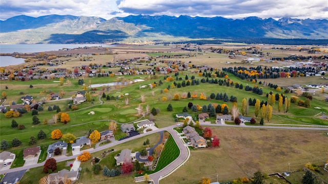 birds eye view of property featuring a water and mountain view