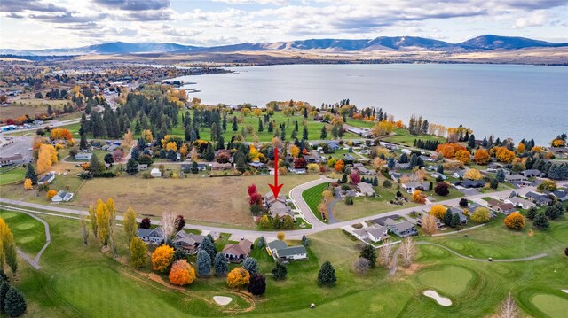 bird's eye view featuring a water and mountain view