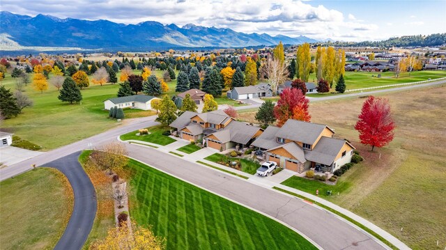 birds eye view of property featuring a water and mountain view