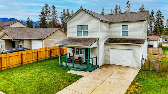 view of front of property featuring a front yard and a garage