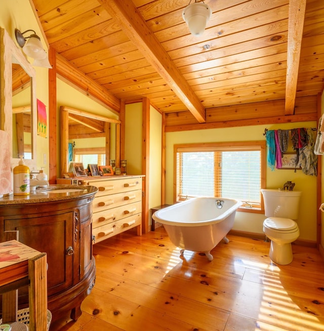 bathroom with wood ceiling, vanity, wood-type flooring, vaulted ceiling with beams, and a tub